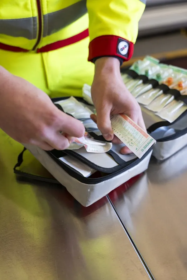 Close-up of hands sorting medical material.