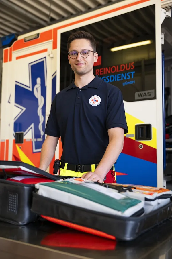 Man standing in front of an ambulance