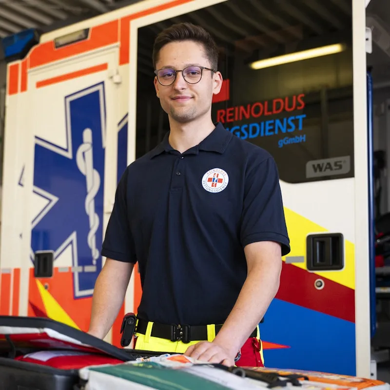 Man standing in front of an ambulance