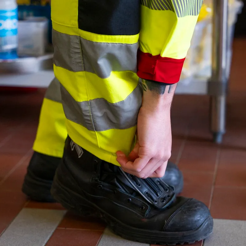 Person binding his shoelaces.